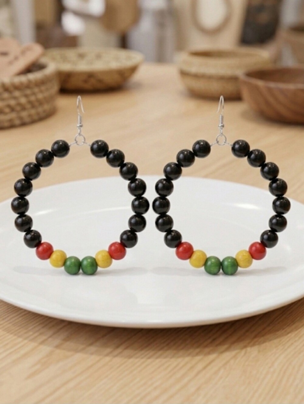 Elegant hoop earrings featuring Black and multicolored wooden beads. Their light - Picture 4 of 7